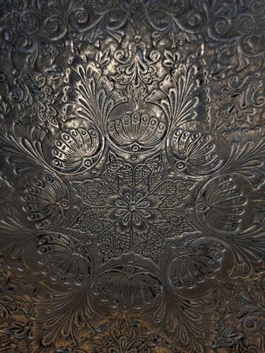 Engraved brass bowl from the mid-20th century with a scalloped edge.