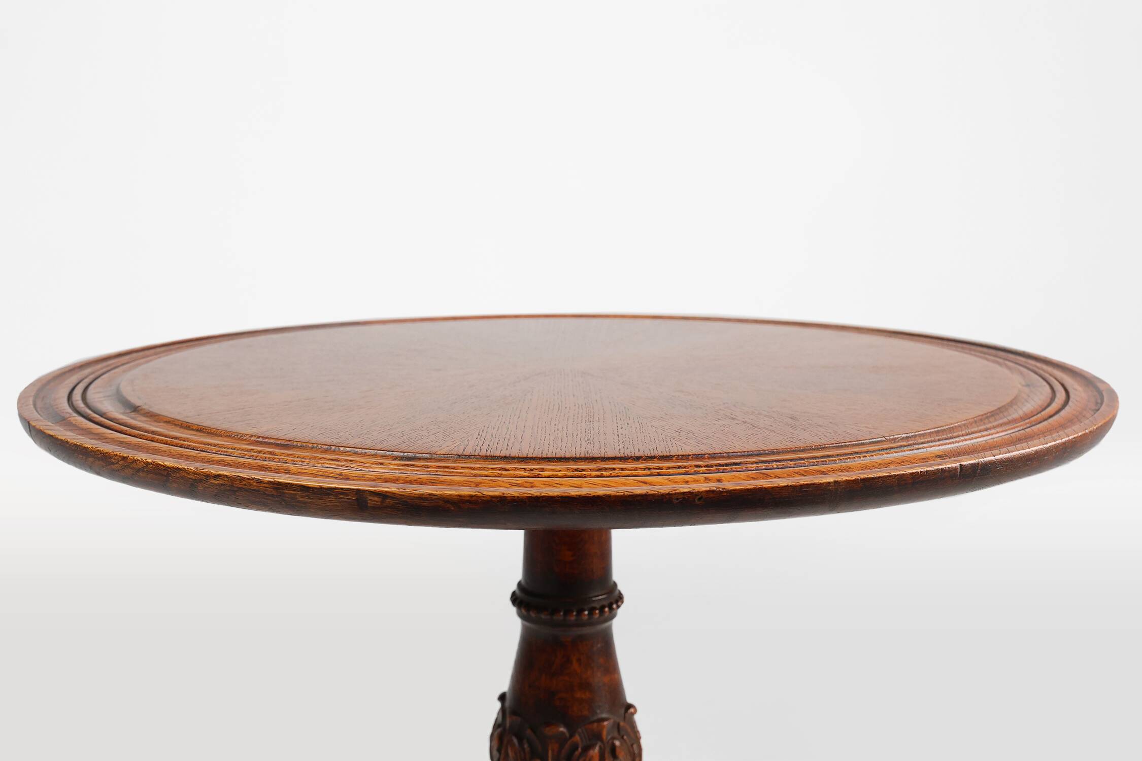 Antique English hand carved circular oak side table with lions head feet