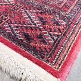 Large red Bokhara-style oriental carpet 300x200 cm with gul patterns.