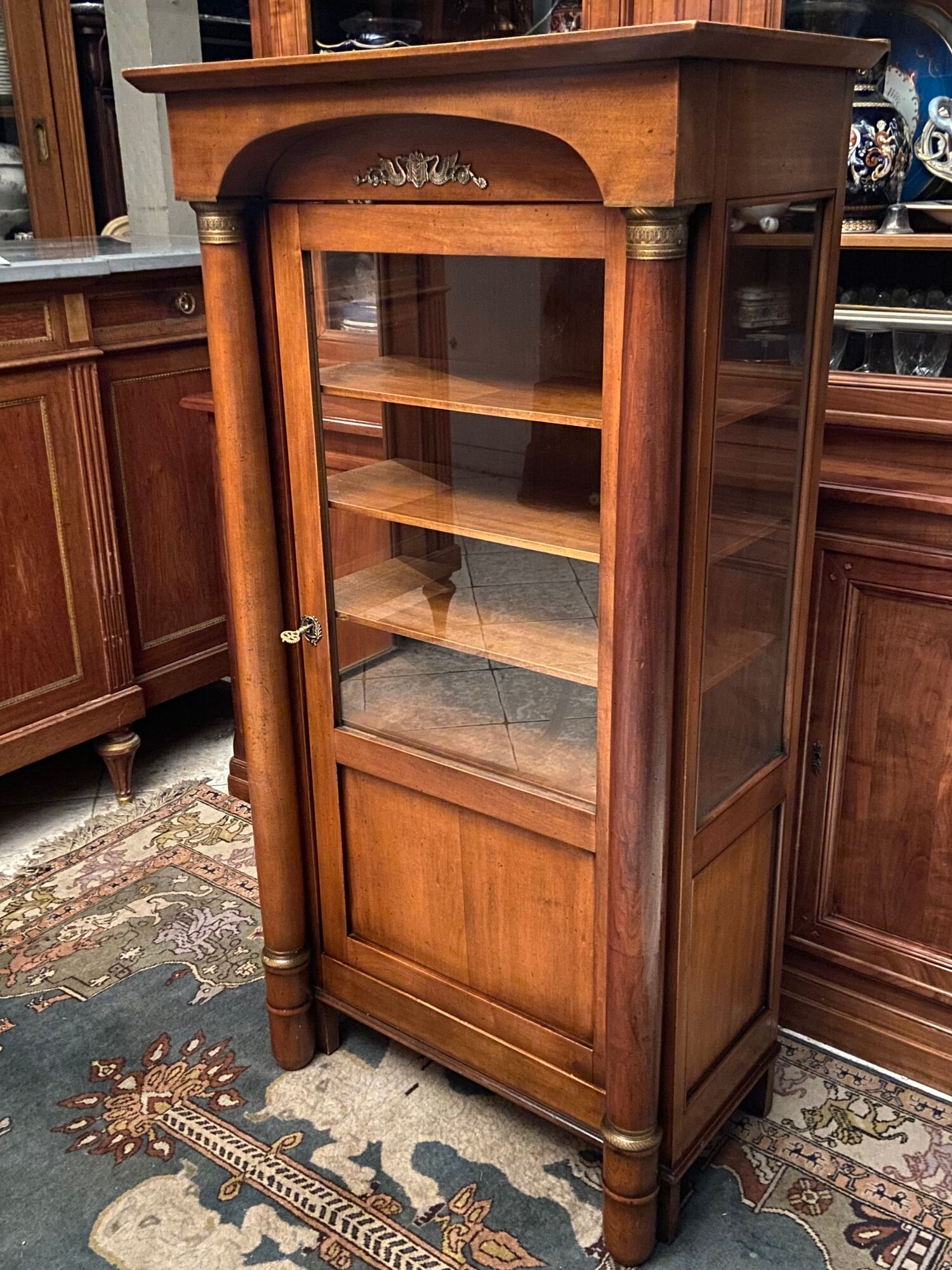 Empire style display case in cherry wood