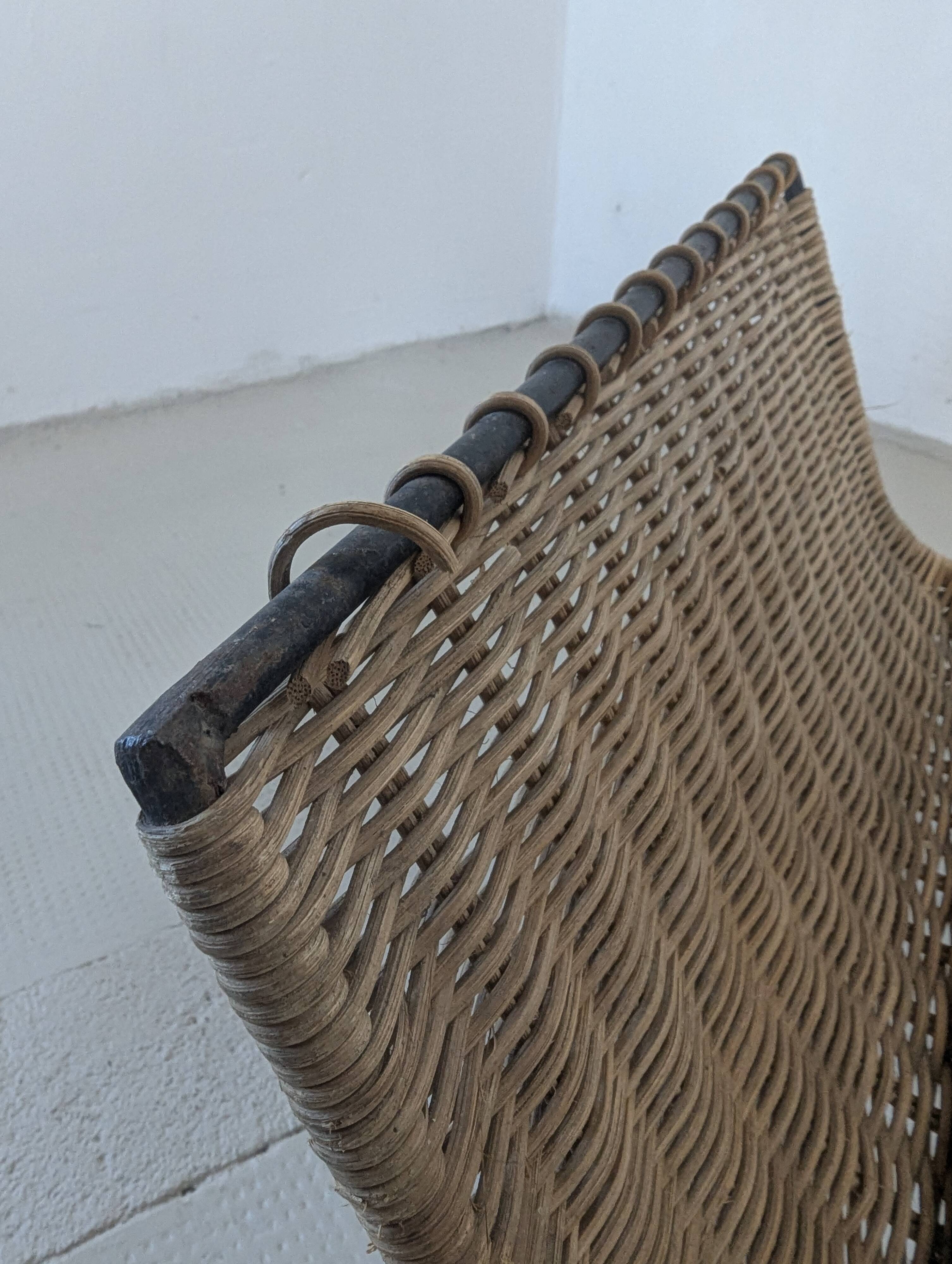 Iron and rattan magazine rack from the 60s