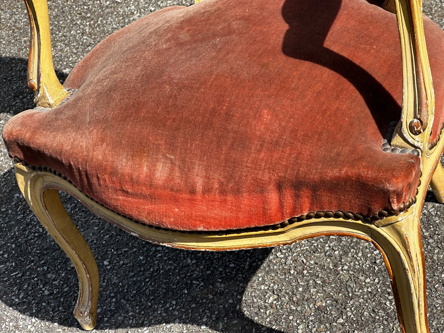 Louis XV cabriolet armchair, patinated wood and antique velvet.