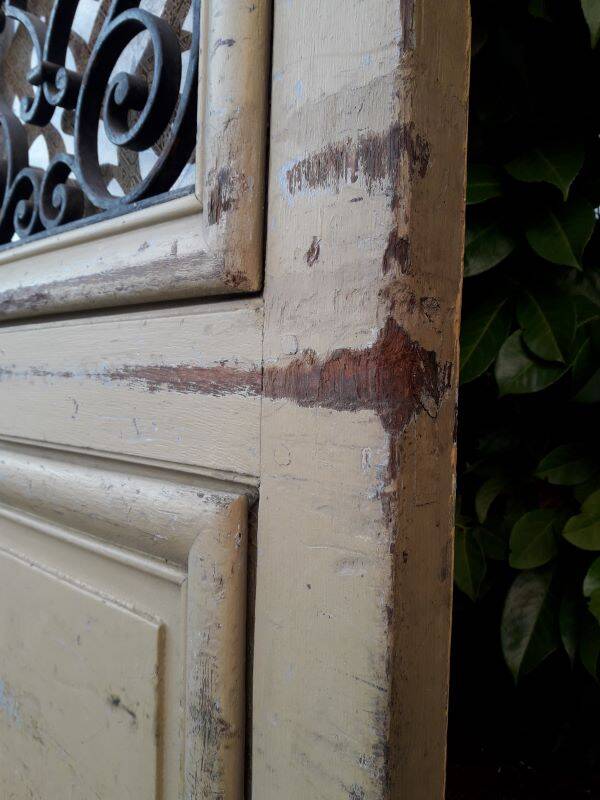19th century double arched entrance door in oak with grilles and old glass
