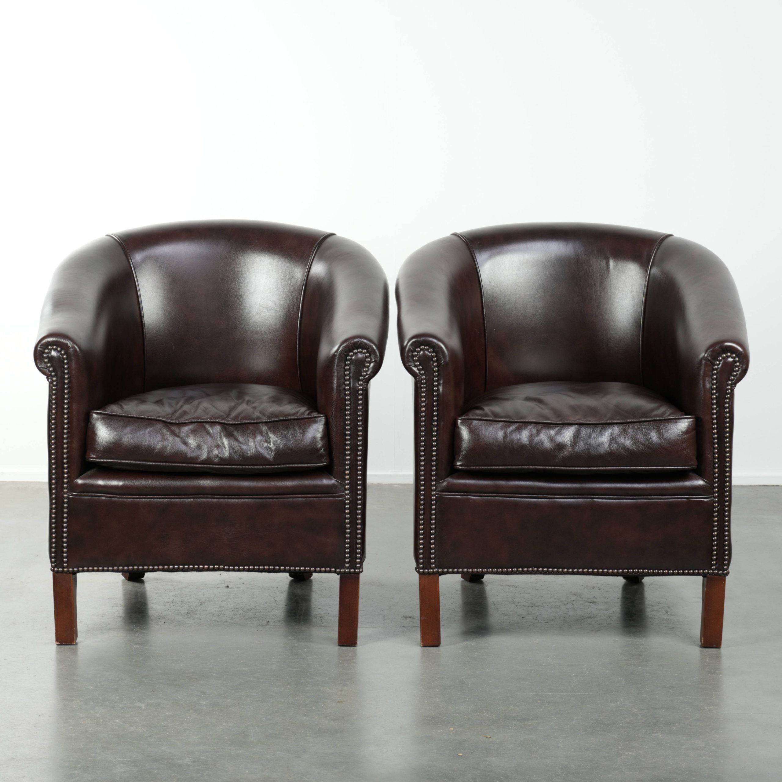 Set of two cowhide club armchairs in good condition with a English design