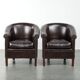 Set of two cowhide club armchairs in good condition with a English design