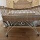 Rattan and wrought iron cradle