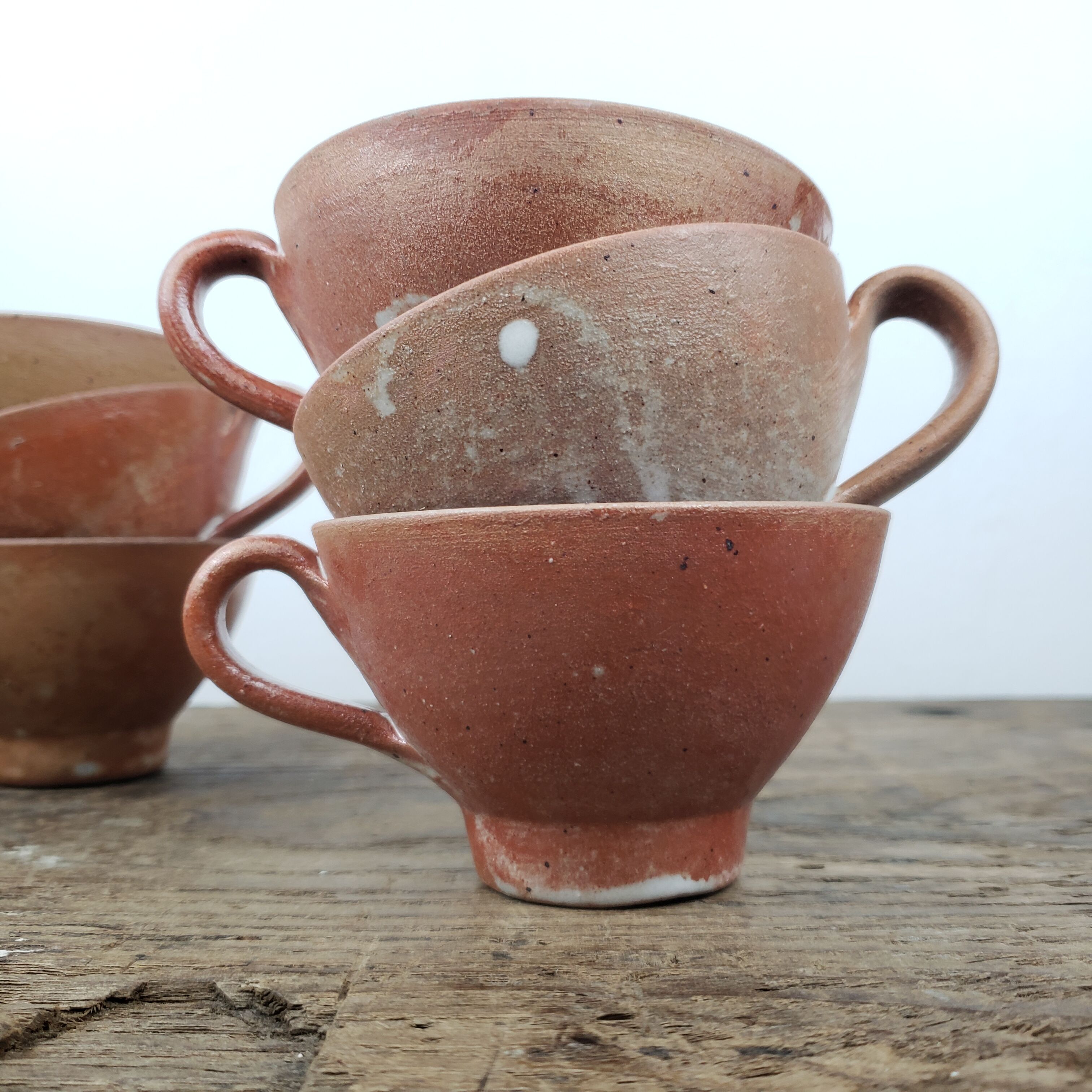 "Bowled" stoneware cups
