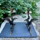 Pair of chimera candle holders in bronze, 19th century.