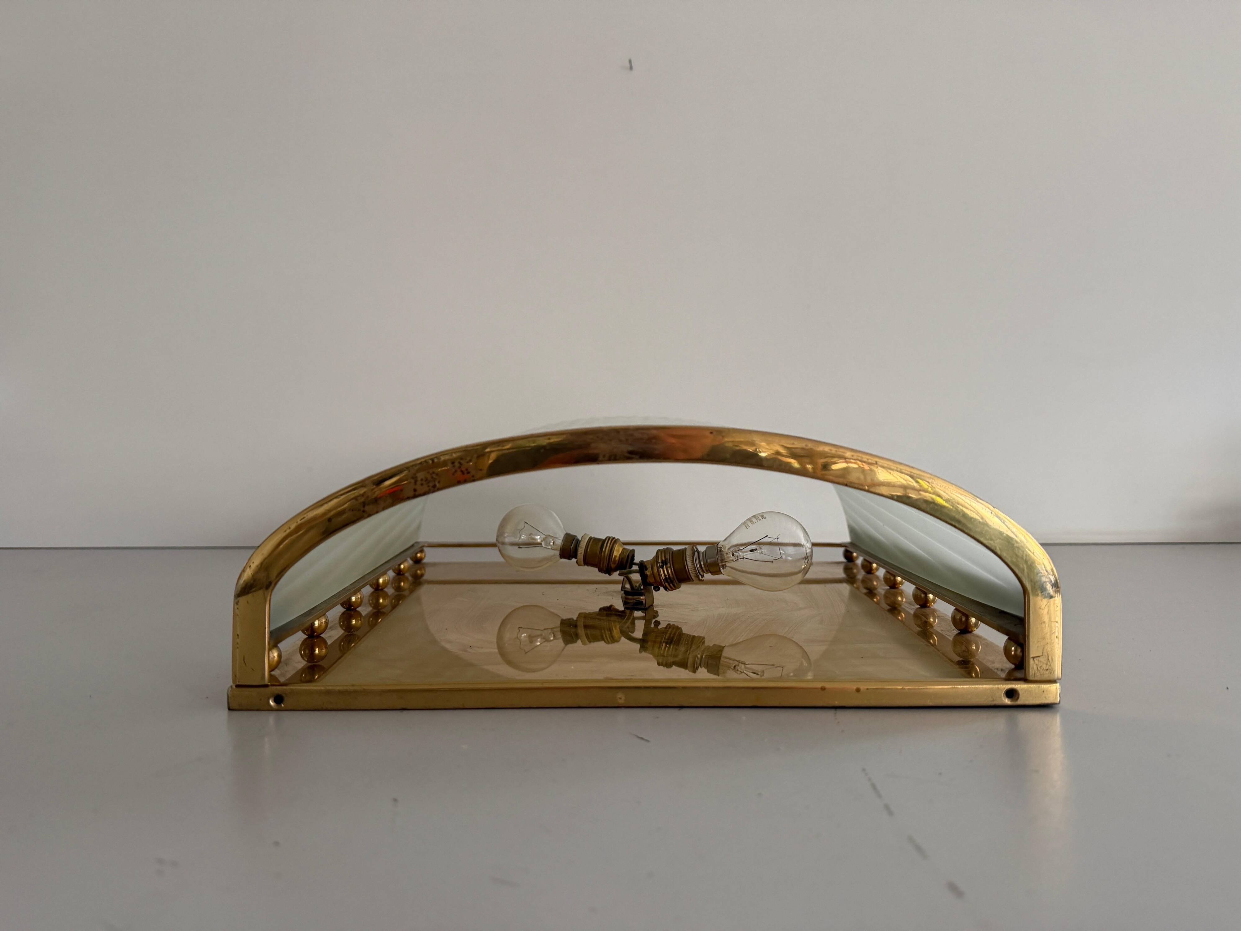 Large heavy glass wall light with a brass frame from the mid-century, 1950s, Italy.