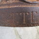 Pair of antique women's head cast iron chenets