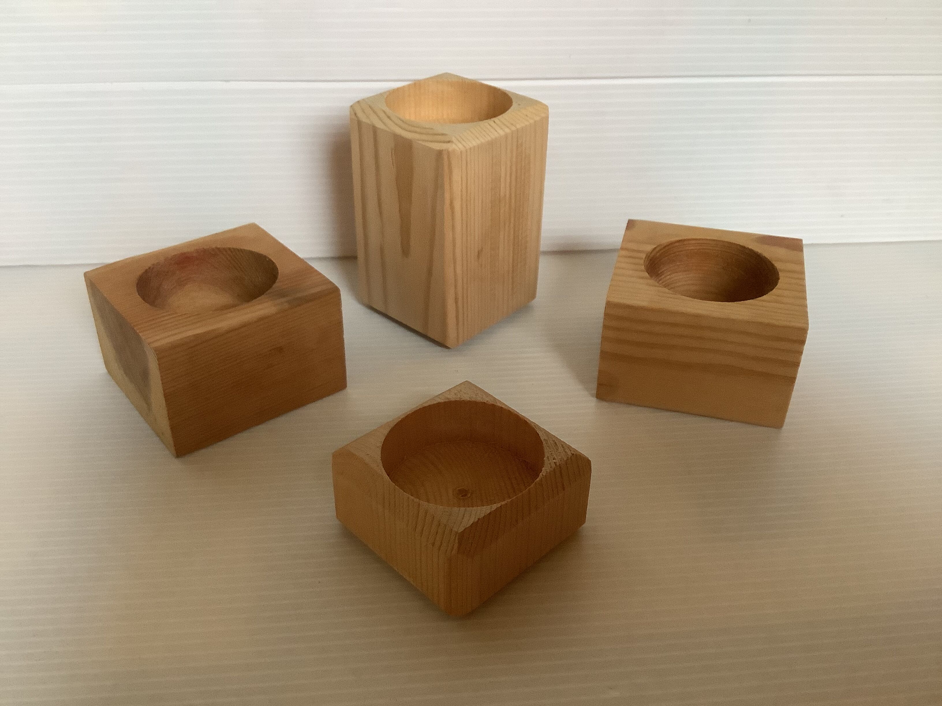 Set of four scandinavian wooden candle holders