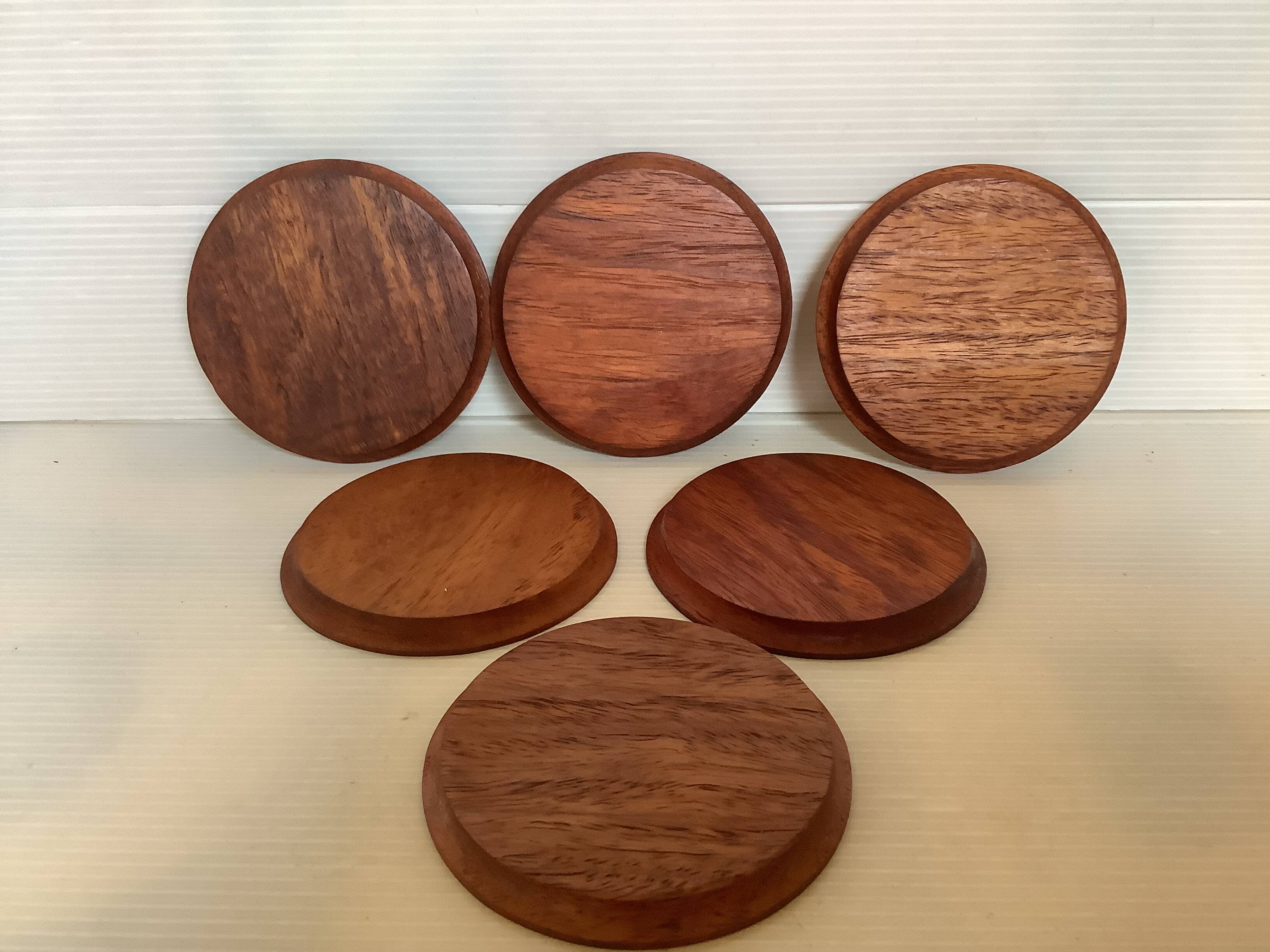 Six mother-of-pearl teak wood coasters