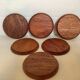 Six mother-of-pearl teak wood coasters
