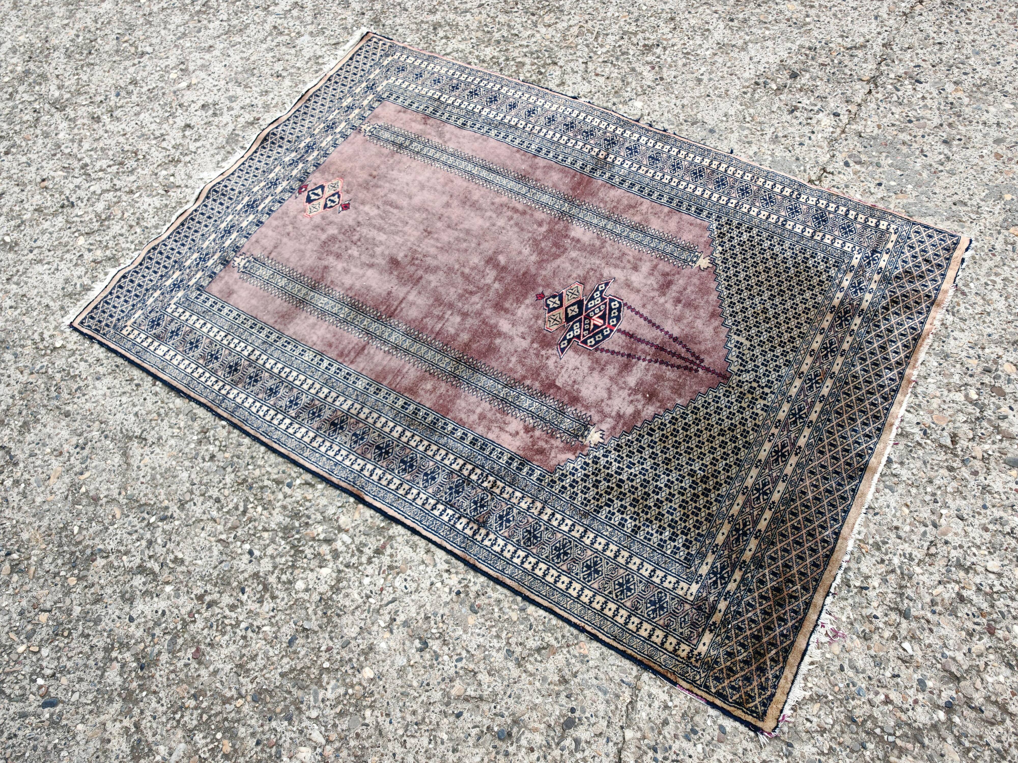 Vintage Anatolian prayer rug made of hand-knotted wool.
