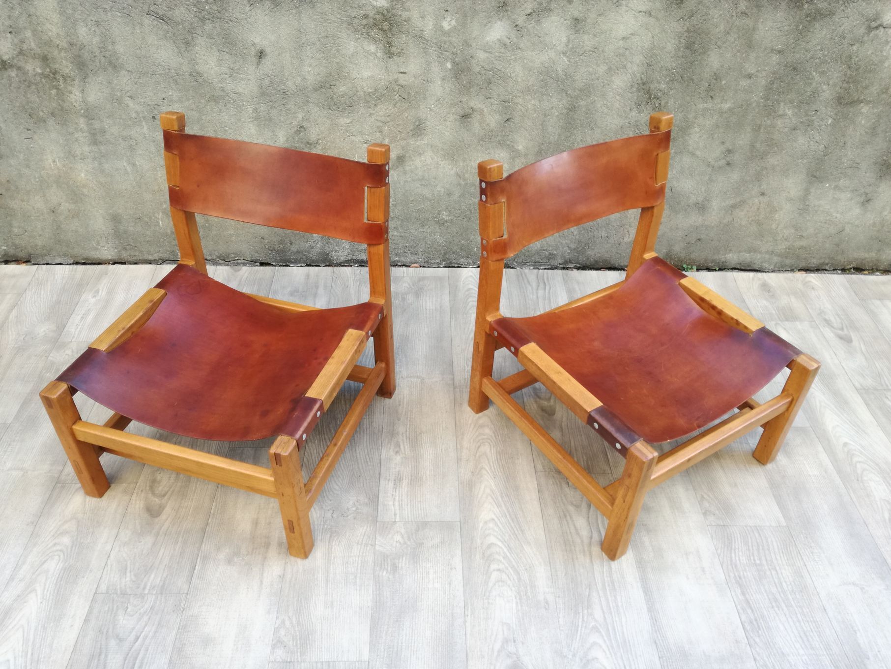 Pair of elm and leather heaters by Maison Regain, 1960s