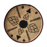 Braided wicker dish with ethnic motifs