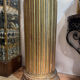 Large fluted golden wood column with a marble top, work from around 1900.