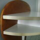 White lasked wood console and 1980s skai background