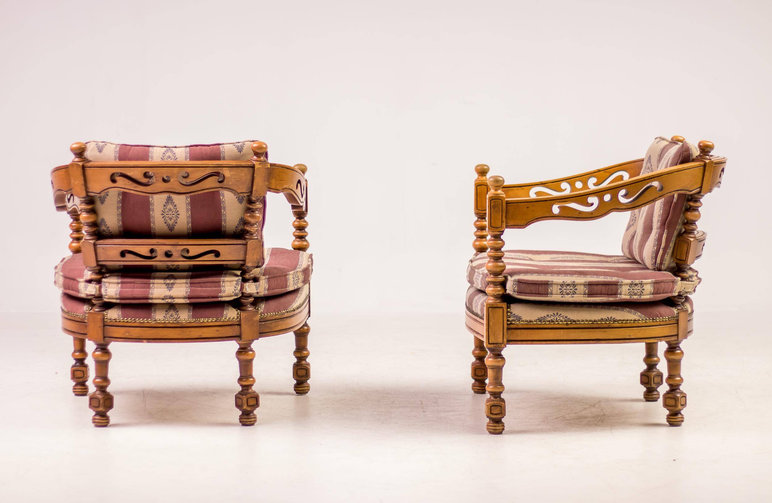 Pair of Giorgetti "1975 Gallery" armchairs in carved wood, original upholstery.