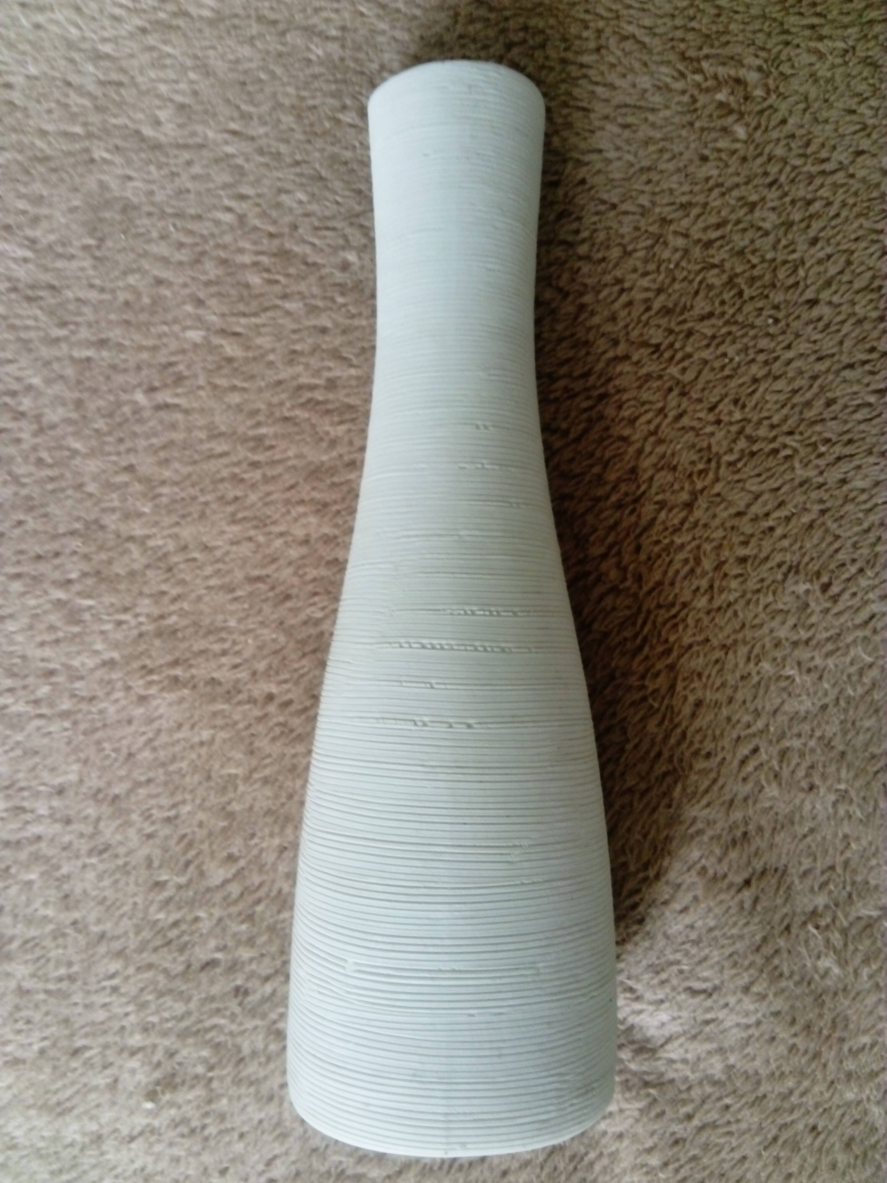 White ceramic vase with fine streaks