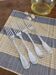 Set of 4 decorative forks with a rim