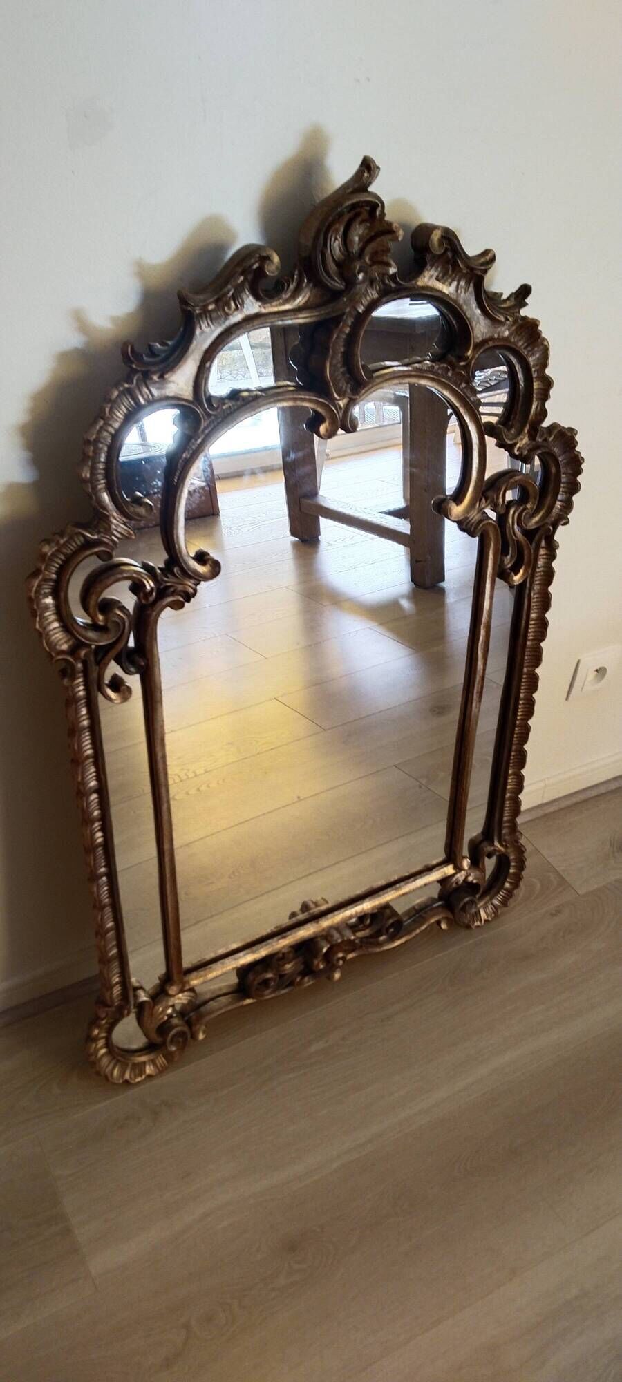Antique mirror with rococo-style pareclose, in gilded wood, 19th century