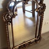 Antique mirror with rococo-style pareclose, in gilded wood, 19th century
