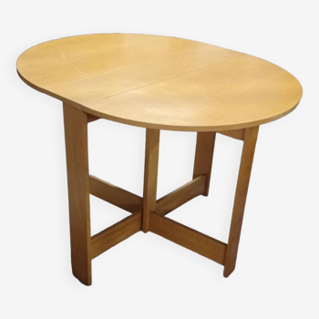 Foldable oval wooden table
