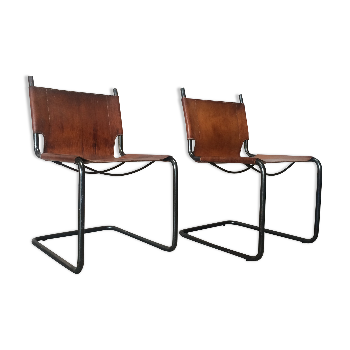 pair of tubular chairs in tawny leather