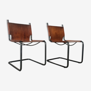 pair of tubular chairs in tawny leather