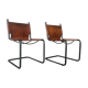 pair of tubular chairs in tawny leather