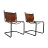 pair of tubular chairs in tawny leather