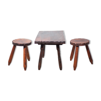 Set of coffee table and 2 carved wooden stools, brutalist