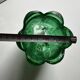 Green glass paste emptying cup from the Art Deco period