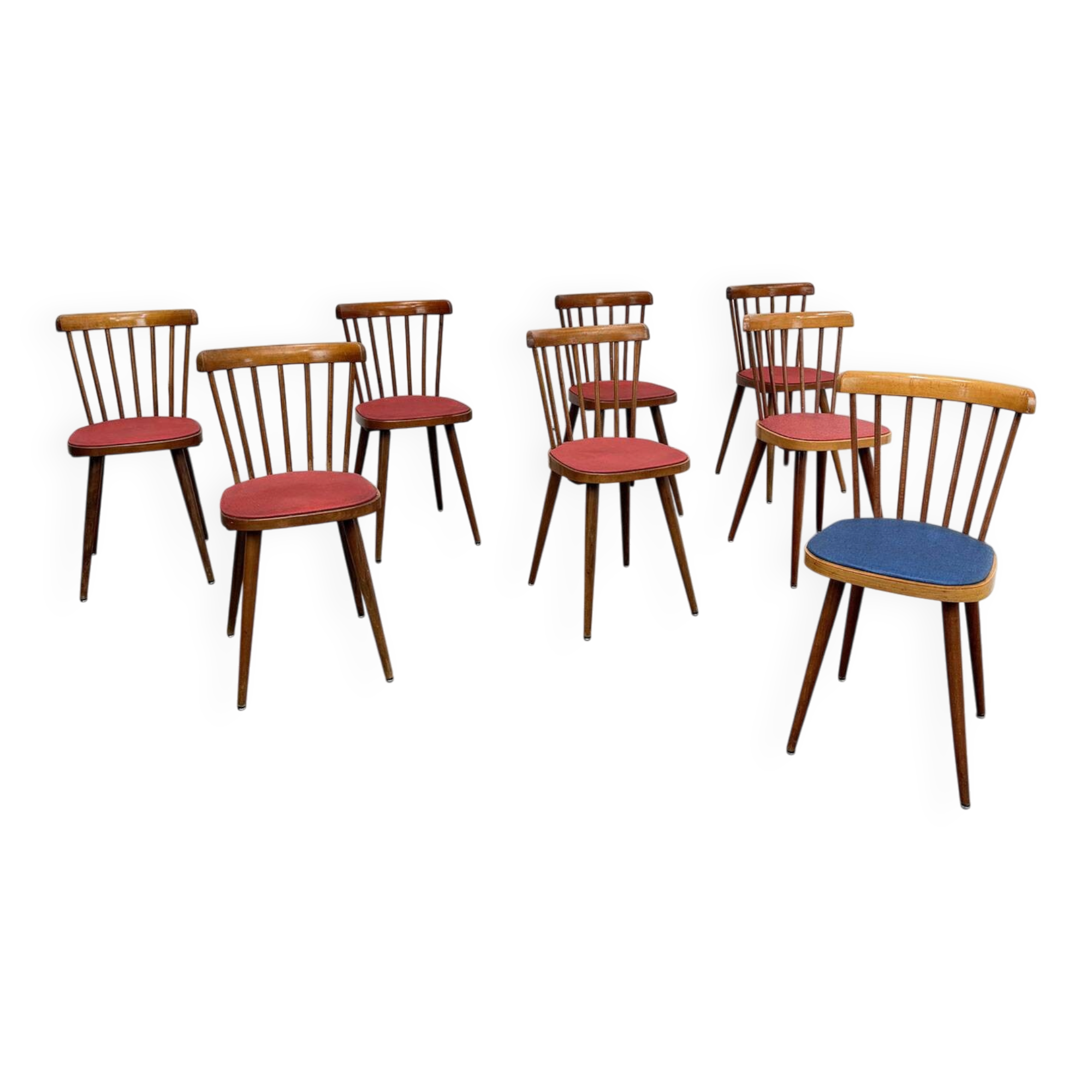 Huit chaises Baumann à assise colorée