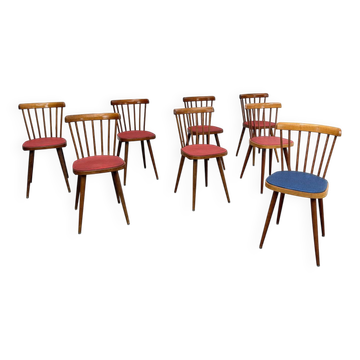 Huit chaises Baumann à assise colorée