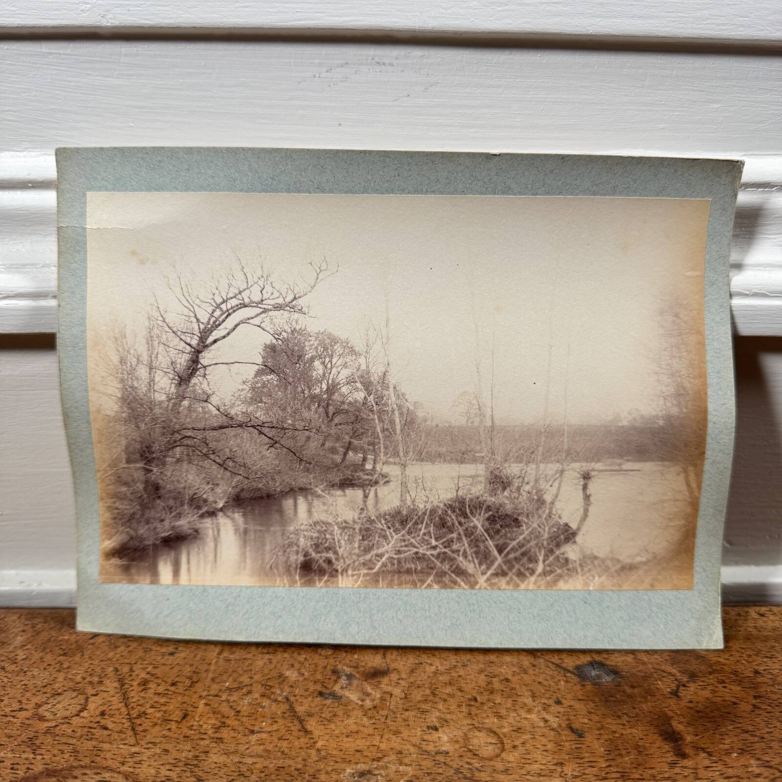Photo album glued onto cardboard depicting a 19th-century watercourse.