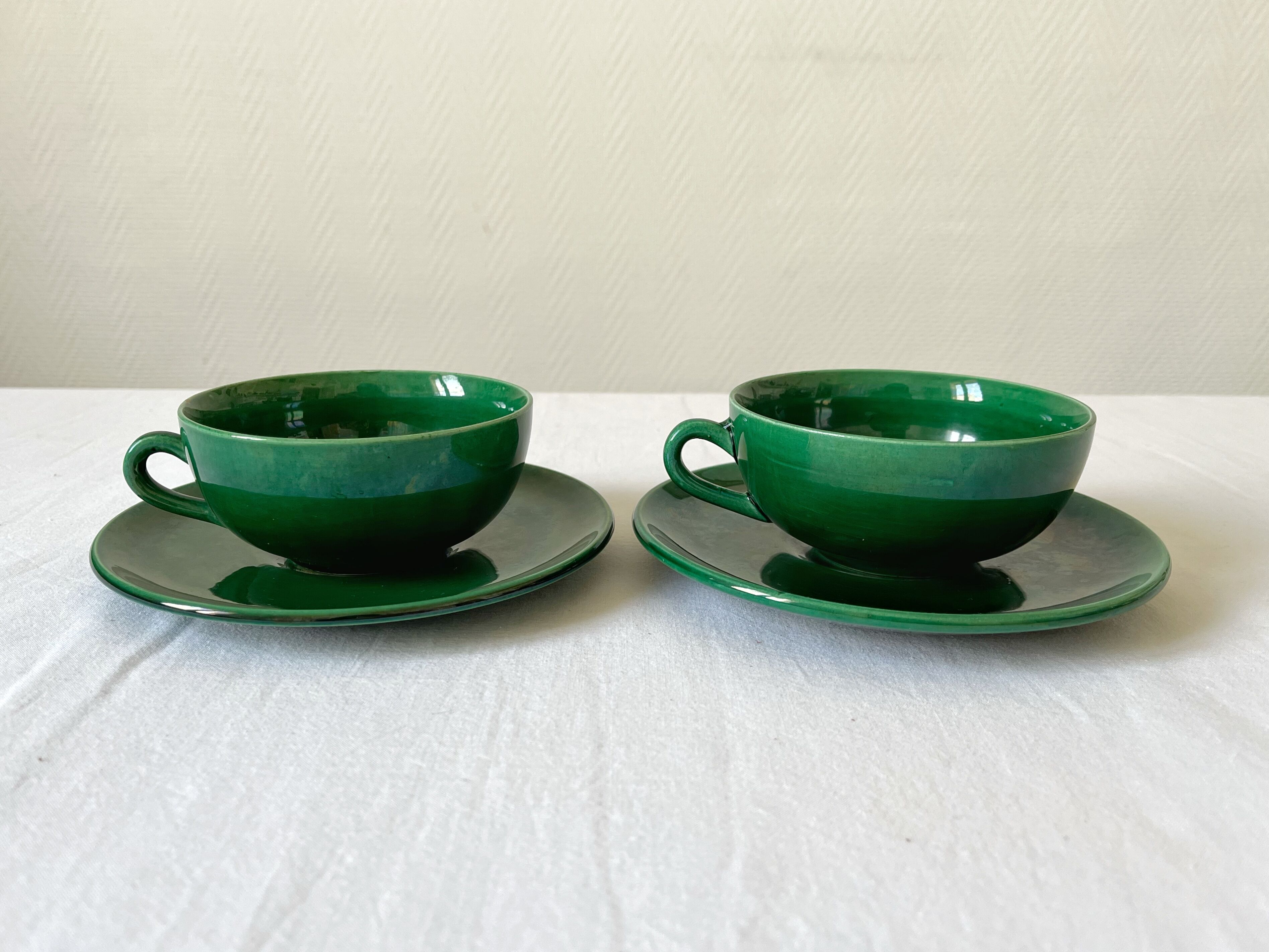 2 old green coffee cups in earthenware of Saint Clement