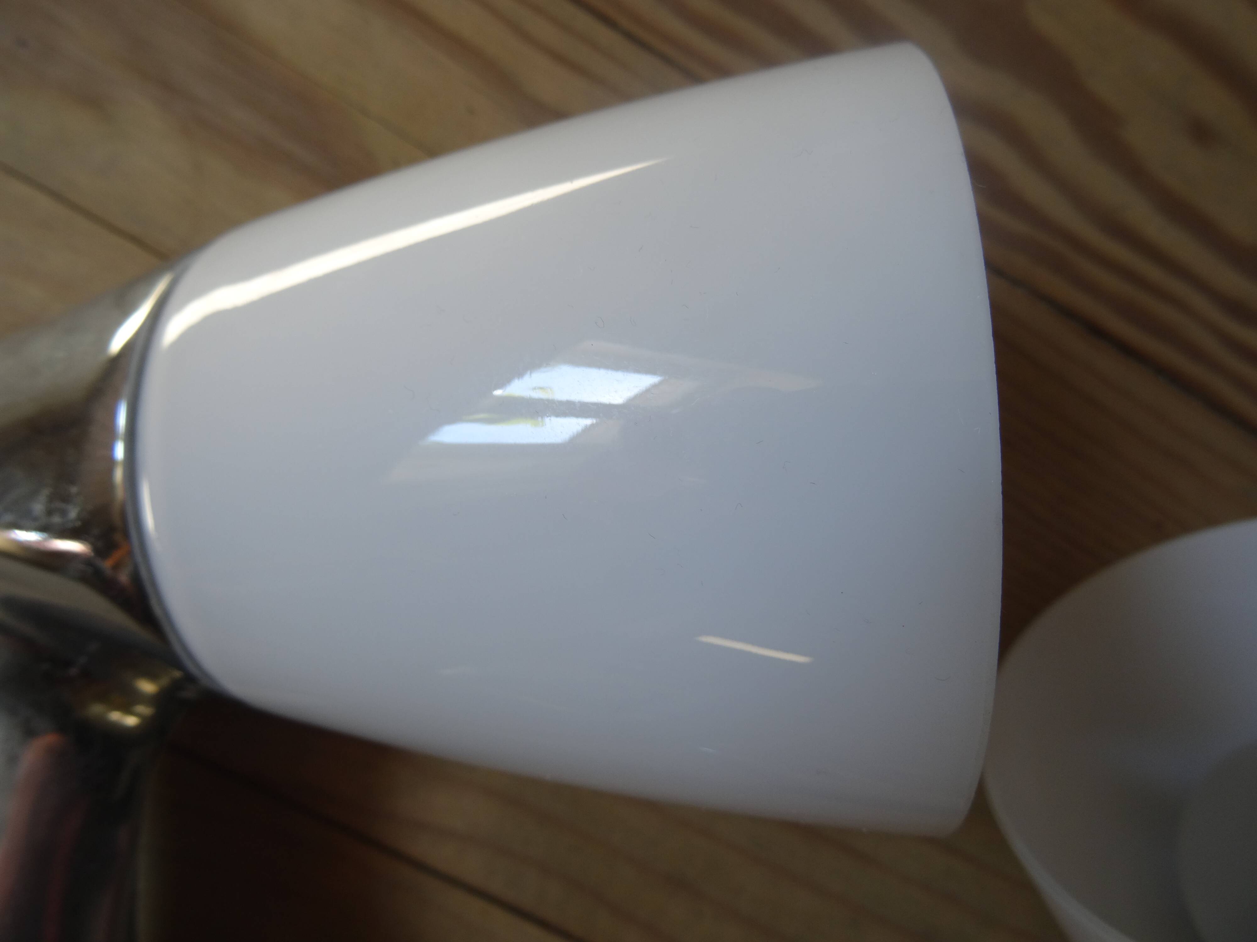 Pair of stainless steel and opaline wall lamps