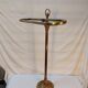 Old golden brass towel rack on baroque style foot