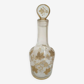 Old crystal carafe with golden decoration