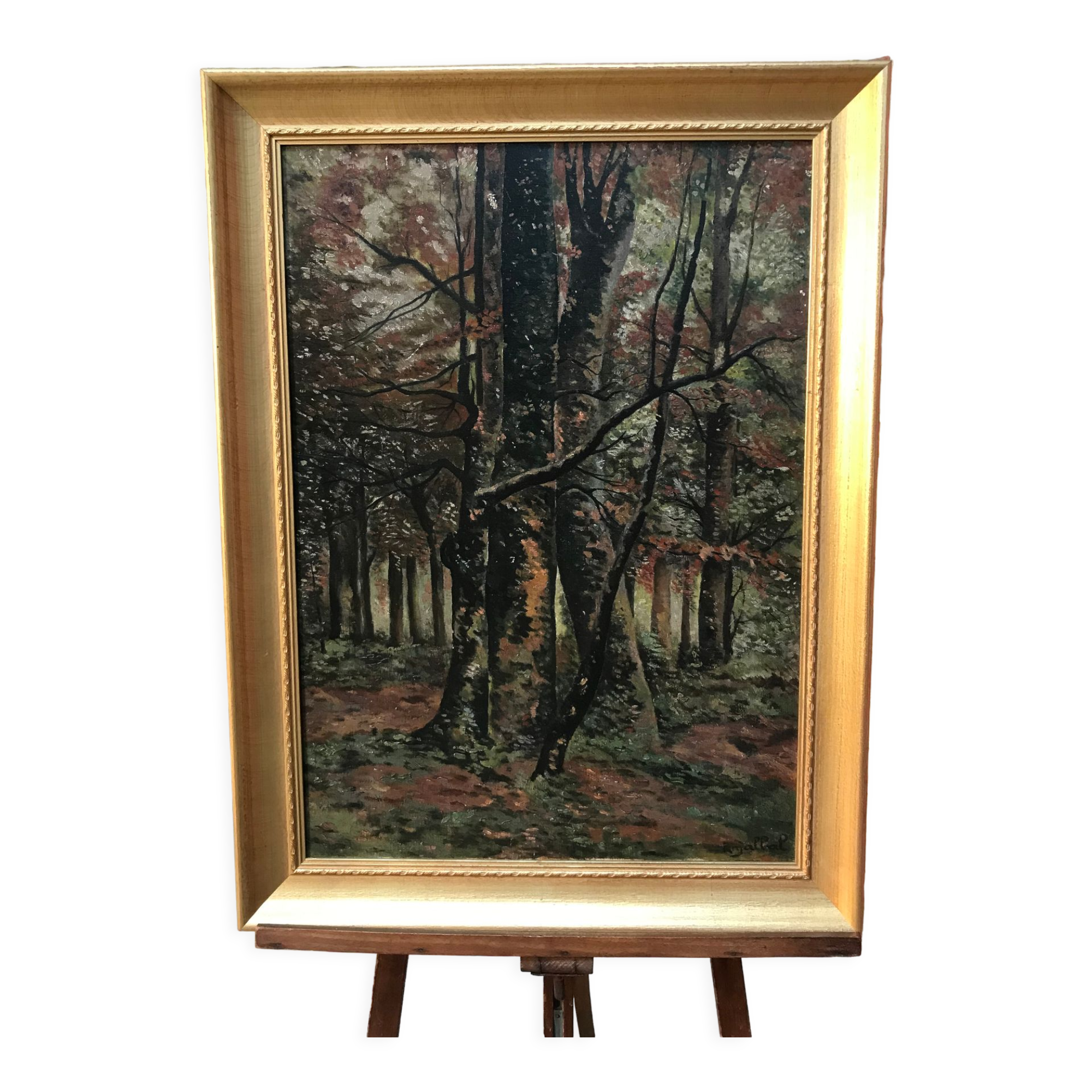 Framed painting depicting a forest