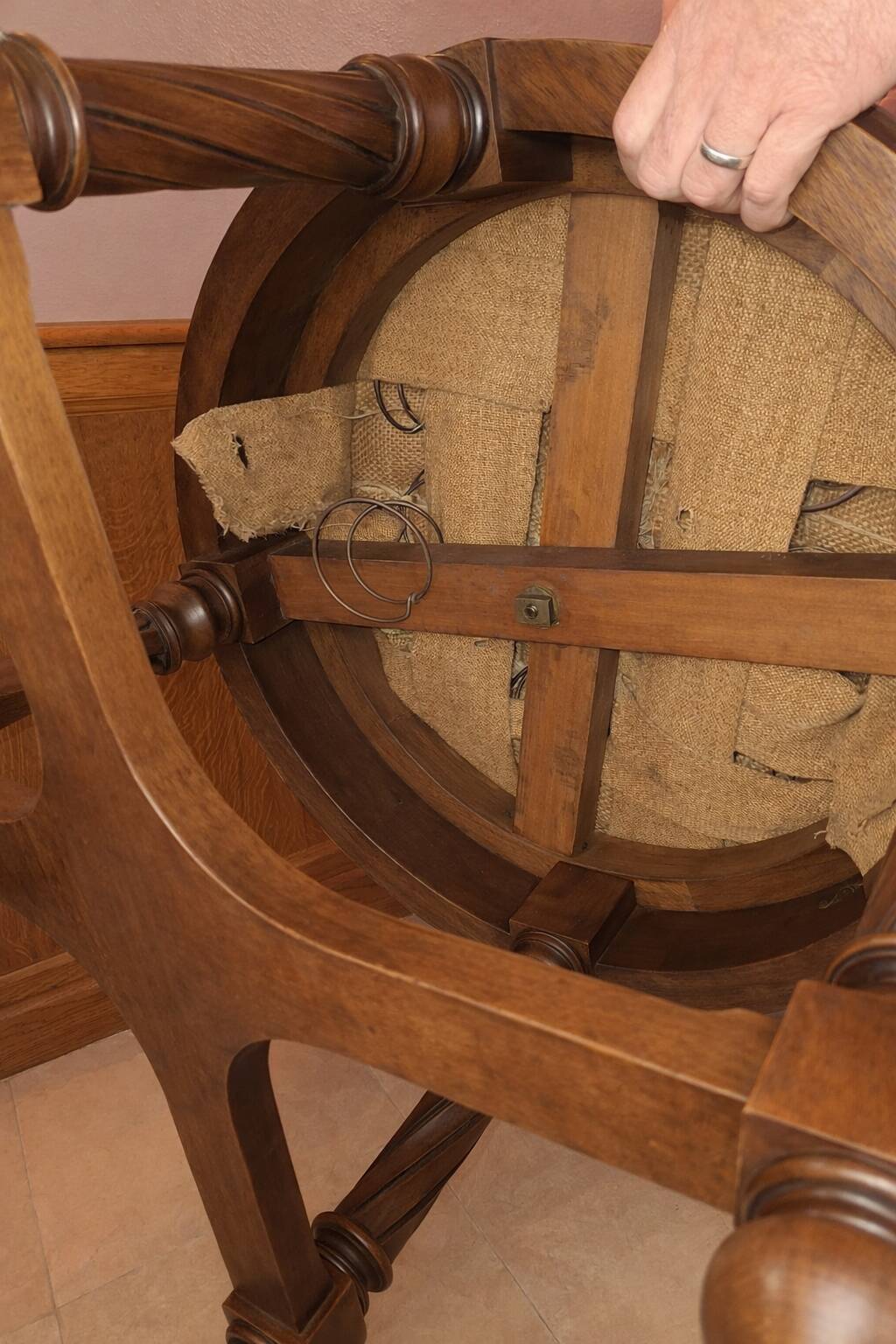 Antique swivel armchair in carved wood and patinated leather – neo-Renaissance style