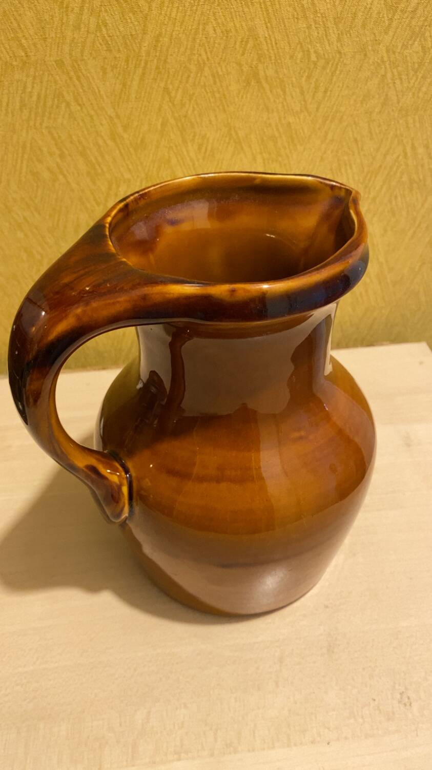 St. Clement brown ceramic pitcher, 1970
