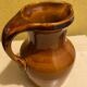 St. Clement brown ceramic pitcher, 1970
