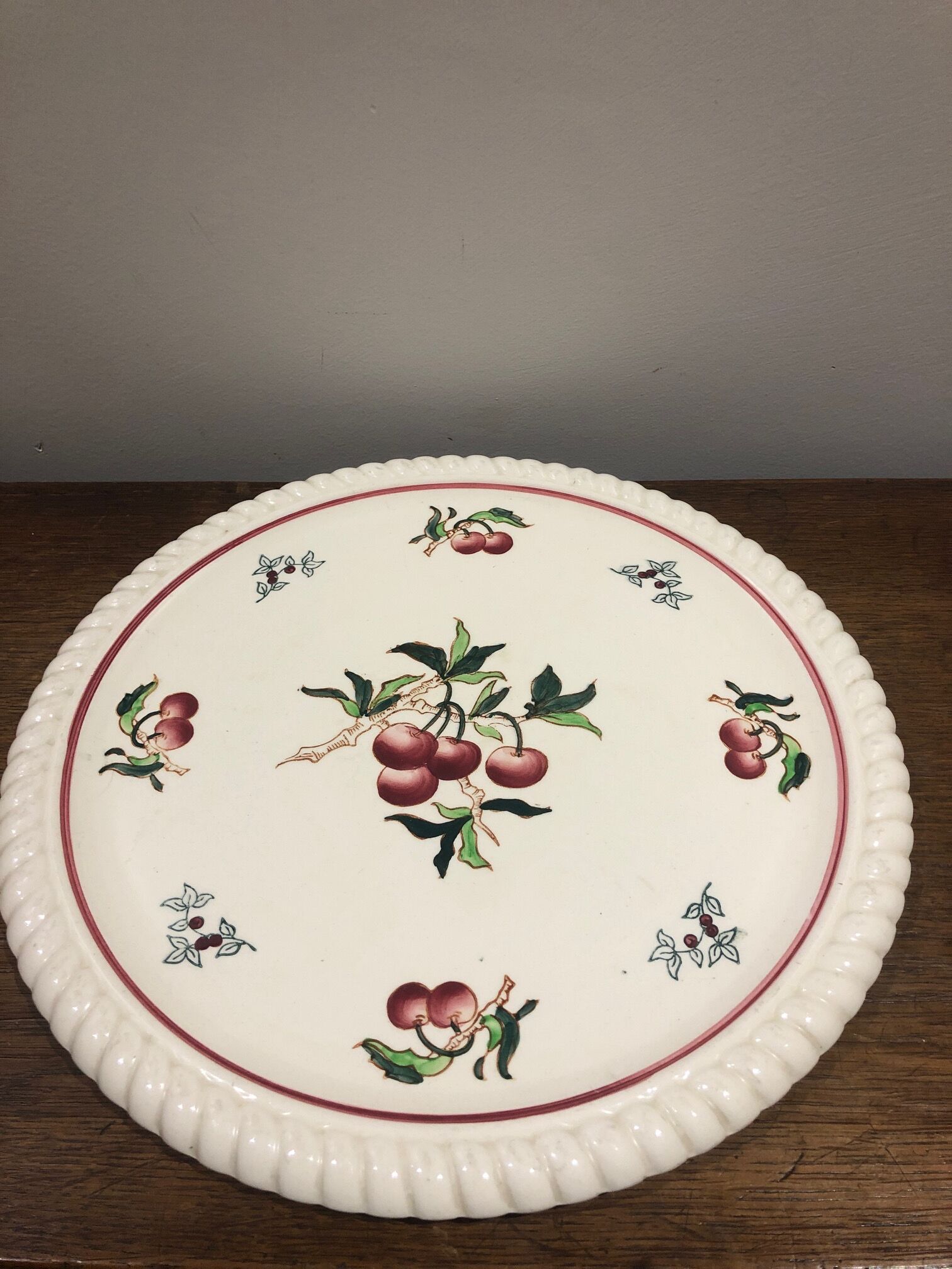 Longwy earthenware dish decorated with cherries