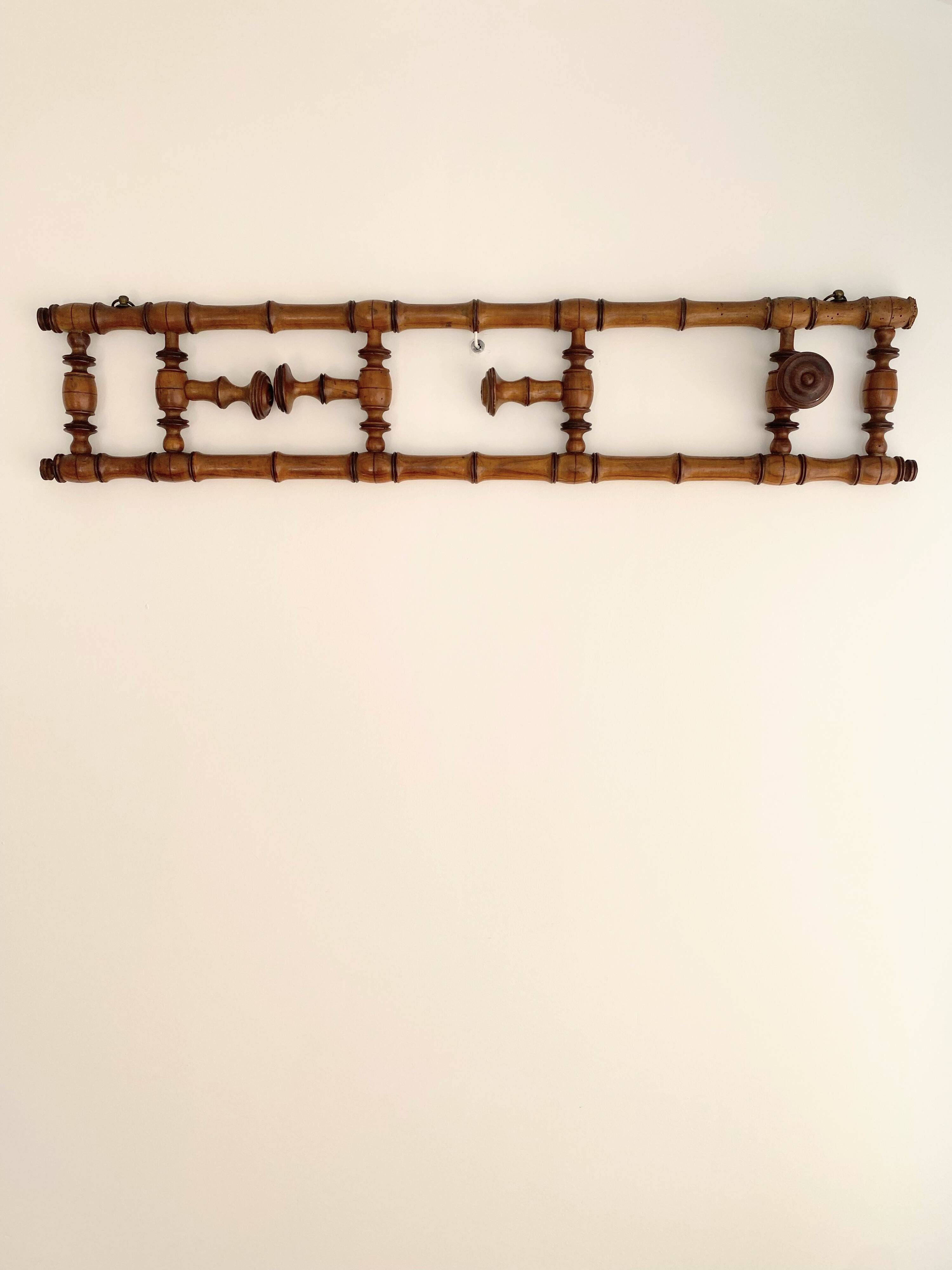 Vintage wooden wall coat rack with 4 swivel hooks from 1920