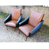 Paire de fauteuils en simili cuir