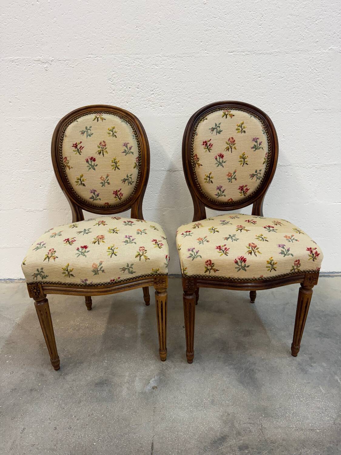 Pair of Louis XVI medallion chairs with canvas.