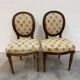 Pair of Louis XVI medallion chairs with canvas.